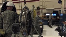 US Air Force Men Repair a Huge F 16 Jet Engine Damaged by Aerial Debris
