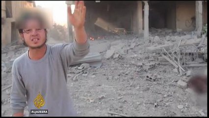 Dozens of civilians killed in air strike on Damascus market