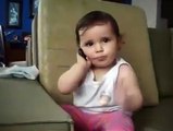 adorable baby is talking on phone