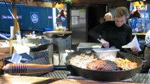 London Street Food at Christmas Time. The Roast Pork and Vegetables. The Roasted Chestnuts