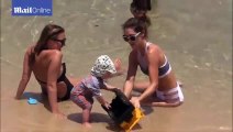 Stunning Erin McNaught plays at Bondi beach with son Evander