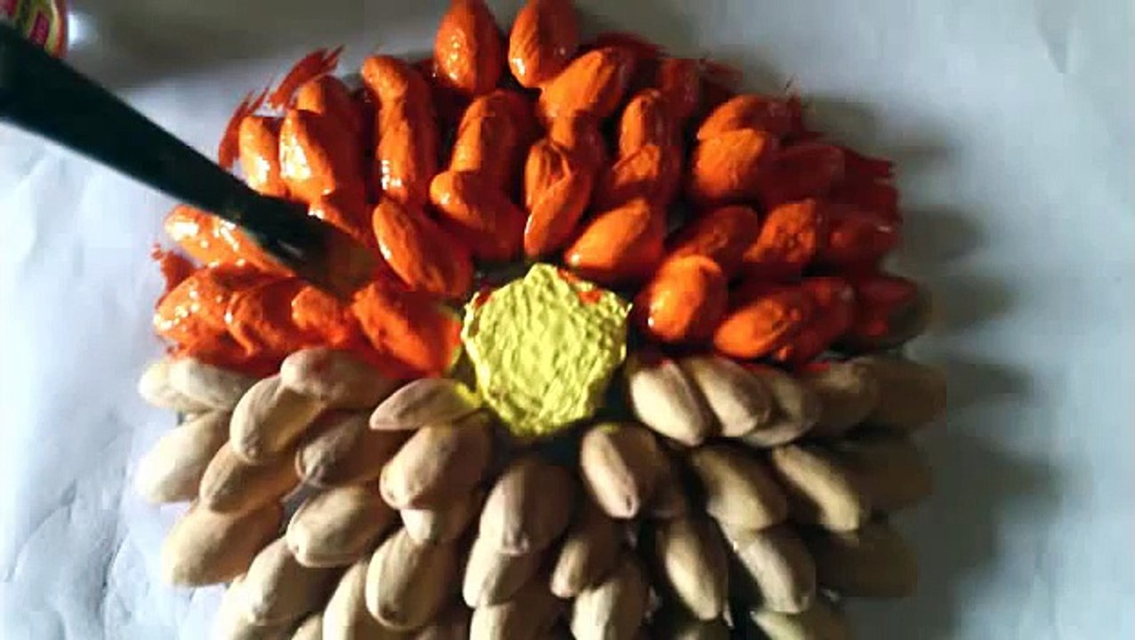 Flowers( _ rangoli) with pista shells cd