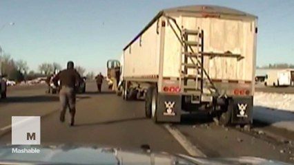 Heroic cop jumps into moving truck to stop it from crashing