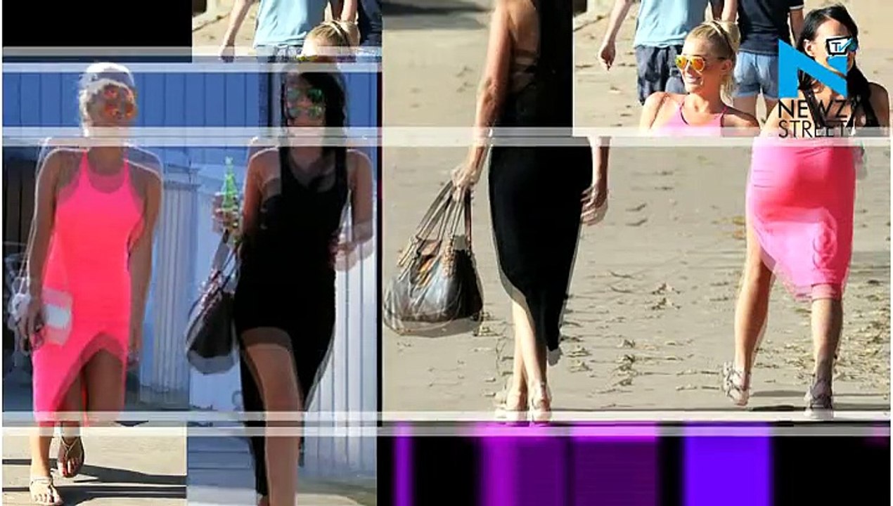 Zilda Williams goes braless in fluorescent figure-hugging dress