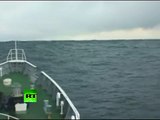 Tsunami Climbing Incredible video of ship heading into wave in Japan