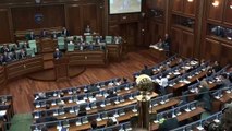 Kosovo: PM Isa Mustafa pelted with eggs in parliament - BBC News