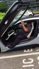 Fat man gets out of BMW i8
