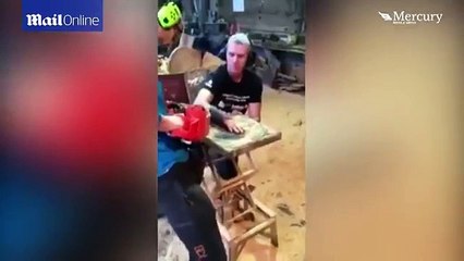 Dad lets his son remove his plaster cast with a CHAINSAW
