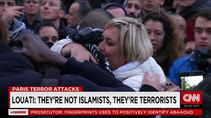 Blindfolded Muslim man offers hugs to mourners
