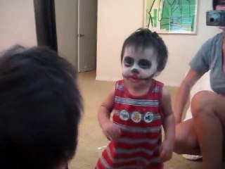 Baby Scares himself in the mirror...
