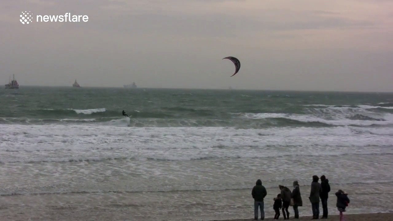 Windsurfers enjoy stormy UK coast