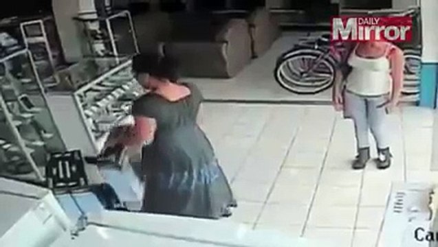 CCTV Camera Captures Bizarre Shop Theft as Woman Steals Plasma TV by Stuffing it up Her Skirt