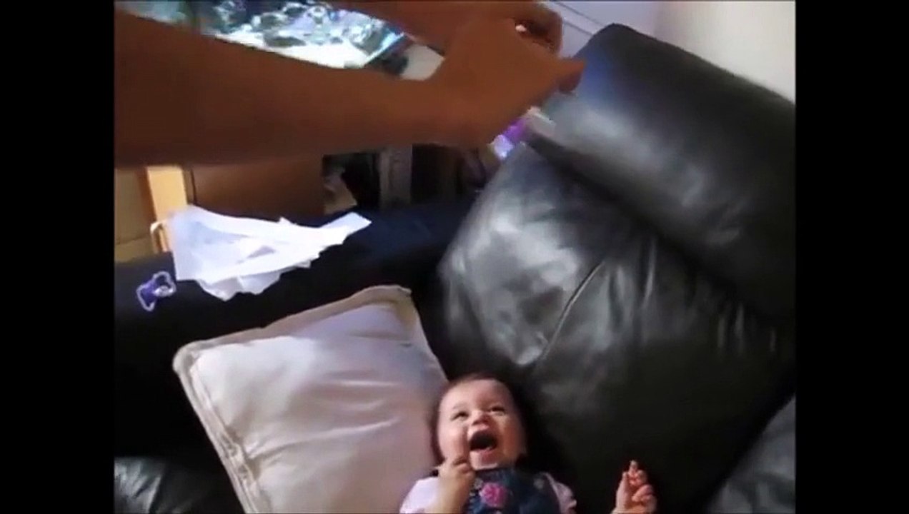 BABIES LAUGH AT PAPER