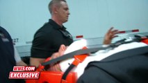 Triple H is loaded into an ambulance after being attacked by Roman Reigns December 13, 2015