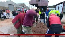 UK Floods: Sandbags and salvage work in Lancashire