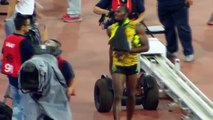 Usain Bolt floored by cameraman on Segway as he celebrates 200m gold