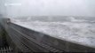 Coastal waves from Storm Frank obscure train windscreen