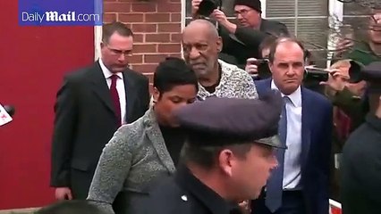 Comedian Bill Cosby leaves a PA court after being arraigned