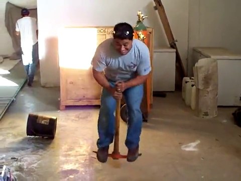 Mexican Worker plays Pogo Stick with a pickaxe