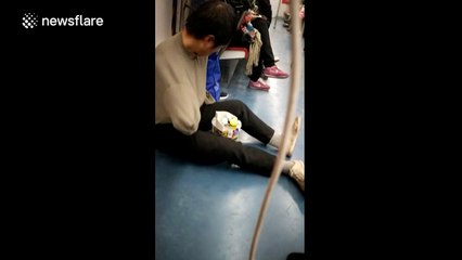 'Armless' man begging on Beijing subway caught out