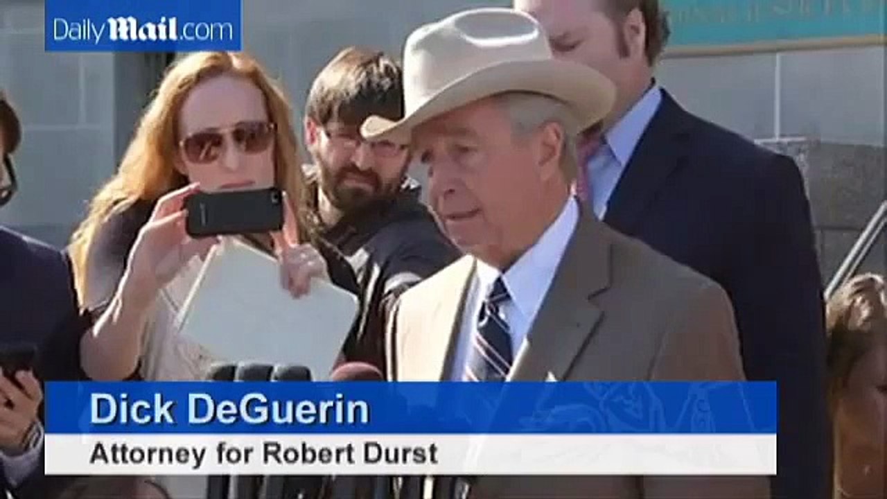 Robert Dust flashes a smile as he heads back to court in March