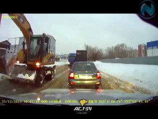 Excavator Truck driver helps stuck Truck to go with his "Arm"