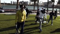 Rafael Nadal and Novak Djokovic play tennis on the beach in Doha.