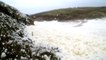 Sea foam deluge on Brittany sea shore