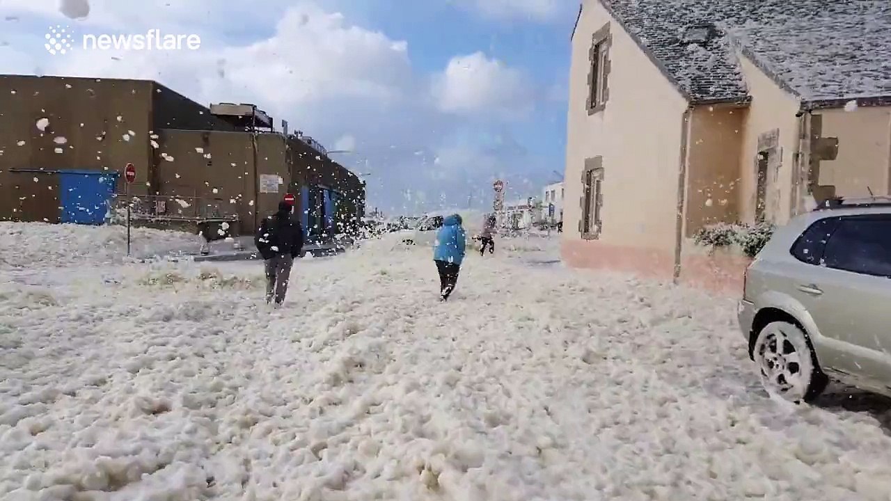 Walking through sea foam blizzard in France