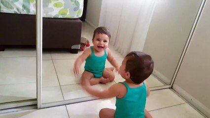 Baby sees himself in mirror for the first time