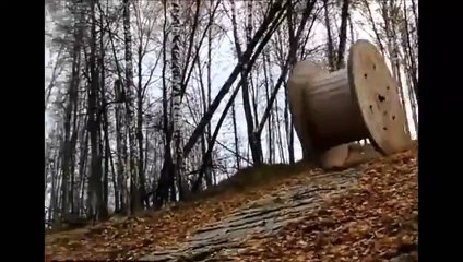Stupid Kids Roll Downhill In A Wooden Spool