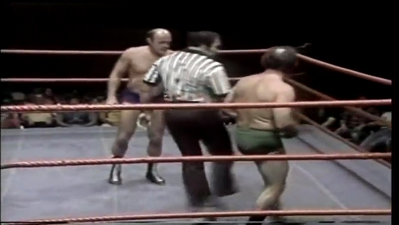 Verne Gagne vs George _Scrap Iron_ Gadaski with The Iron Sheik as referee