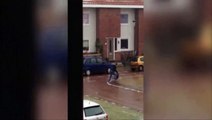 Guy trying to take out the rubbish hilariously refuses to be beaten by icy pavement