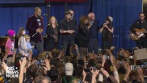 Sanders sings This Land is Your Land with band at rally