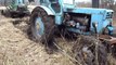 John Deere 810D stuck in mud, tractor T 40AM pulling out