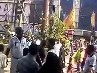 Crowd of people celebrating muslim festival MAHARUM by doing parade on the street at daylight