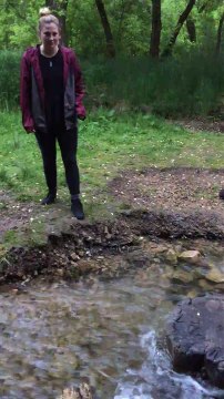 Girl Hurts Butt on Rock while Crossing Stream