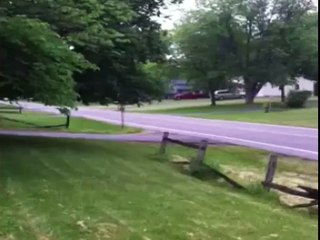 Man on Scooter Crashes Into Wooden Fence