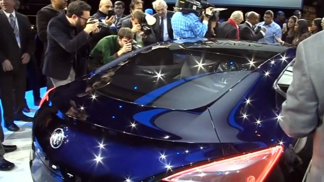 Carmakers' rush to put latest tech in lower-priced models - Reuters