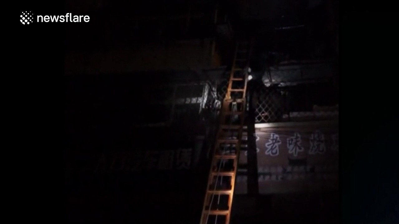 Drunk man sleeps on second floor canopy while police try to rescue him