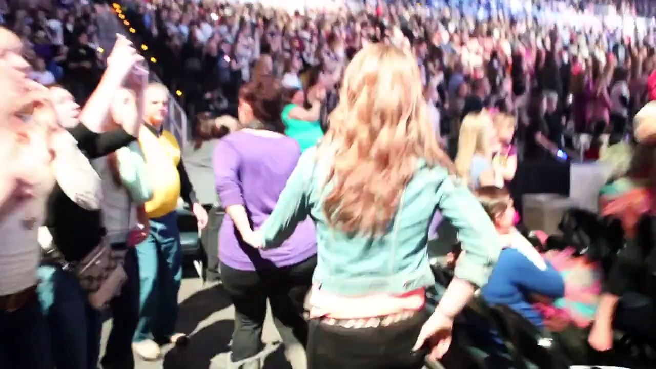 Tori being escorted to the stage as Justin Biebers One Less Lonely Girl