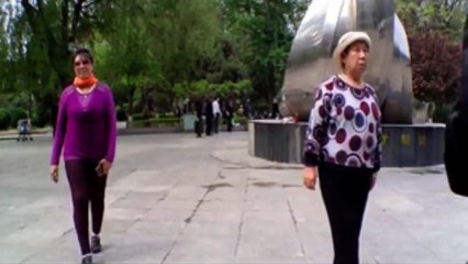 Disco dancing couple in park