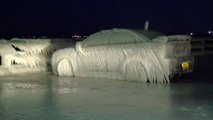 Car entirely covered with Ice while parked near by Lake during Snow Storm