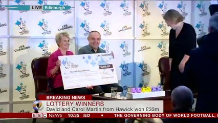National Lottery winners get The cheque's for £33 million.