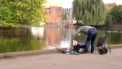 Cruel prankster pushes fisherman into LAKE