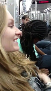 NYC straphanger finds it hilarious that there's a drunk guy that is passed out next to her on the train