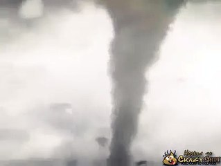 Helicopter gets sucked into a tornado
