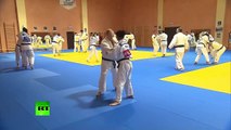 Judo Chop! Putin spars with Russian team in Sochi
