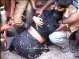 Indian People tease woman stuck in concrete at road