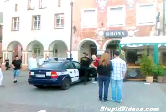 A man ran out in front of two police man very funny running police